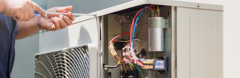 HVAC technician performing furnace repair service in a Las Vegas NV home